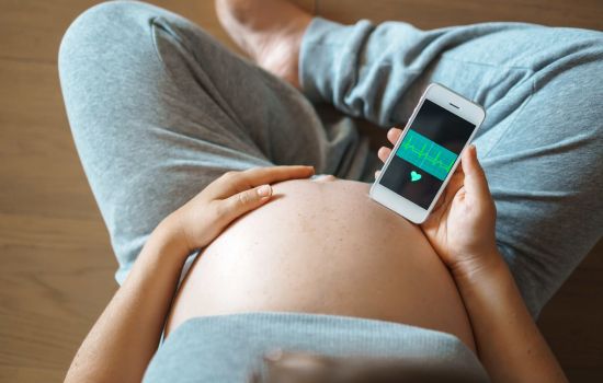 A serene, modern audio recording studio, finely tuned for optimizing sound quality. In the foreground, a sleek audio interface and microphone on an elegant wooden desk, with a visual representation of sound waves softly glowing in the air. In the middle, a display screen showcasing audio levels and waveforms, casting a gentle blue light. In the background, comfortable seating and soundproof panels enhance the ambiance of professionalism. Soft, diffused lighting creates an inviting atmosphere, encouraging creativity and focus. The scene is viewed from a slightly elevated angle, providing a comprehensive perspective. The overall mood is calm and inspiring, perfect for a setting that embodies innovation in audio technology.